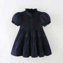 Navy blue dress with puff sleeves on a white background, Obroi
