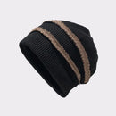 Black knit beanie with brown stripe on a light gray background, Obroi