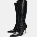 Black knee-high boots on a white background, Obroi