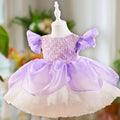 Purple and white dress on a mannequin with a blurred background, Obroi