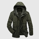 Green hooded jacket on a light gray background, Obroi