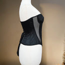 Black corset on a mannequin against a neutral background, Obroi