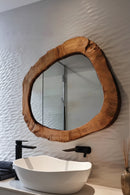 Wooden framed mirror on a textured wall, Obroi
