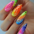 Colorful nail art on a hand with a white background, Obroi