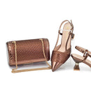 Bronze handbag and high-heeled shoes on a white background, Obroi