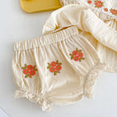 Beige baby bloomers with floral embroidery on a white background, Obroi