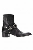 Black leather boot with silver buckle on a white background, Obroi