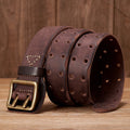 Brown leather belt with brass buckle on a wooden surface, Obroi
