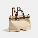 Beige handbag with brown straps on a light gray background, Obroi