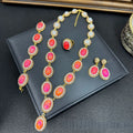 Jewelry set with necklace, earrings, and ring on a dark surface, Obroi