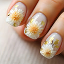 Nails with floral design featuring white flowers and gold accents on a light background, Obroi