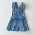 Blue denim overall dress on a white background, Obroi