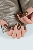 Close-up of hands with brown nail polish on a white background, Obroi