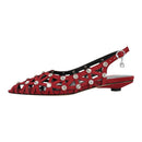 Red sandal with rhinestone embellishments on a white background, branded 'Obroi'.