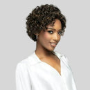 Woman with short, curly hair wearing a white top against a gray background, Obroi