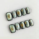 Decorative nails with celestial designs on a light gray background, Obroi