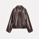 Brown leather jacket on a light gray background, Obroi