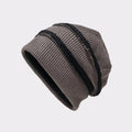 Knitted beanie hat with a ribbed texture on a light gray background, Obroi