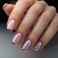 Hand with pink and silver nail polish on a dark background, Obroi