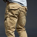 Beige cargo pants on a dark background, Obroi