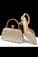 Rose gold clutch bag and high-heeled shoe with intricate design on a white background, Obroi