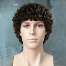 A mannequin bust wearing a short, curly brown wig against a soft gray-blue background, Obroi
