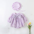 Lavender baby dress with bow and matching hat on a light background, Obroi