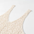 Close-up of a cream-colored crochet knit top with a scoop neckline and wide straps, showing detailed lace-up texture on a clean white background, Obroi