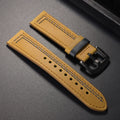 Brown leather watch strap with black buckle on a gray background ,Obroi