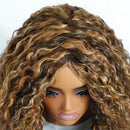 Close-up of a wig with curly brown hair on a mannequin head, Obroi