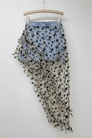 Skirt with butterfly pattern on a hanger against a white background, Obroi