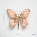 Butterfly-shaped decorative item with glittery details on a white background, Obroi