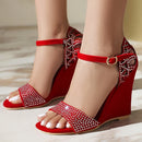 Red wedge sandals with rhinestone details worn by a person on a neutral background, Obroi