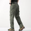 Green cargo pants worn by a person on a white background, Obroi