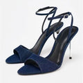 Blue high-heeled sandals with thin straps on a white background, Obroi