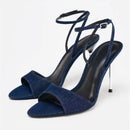 Blue high-heeled sandals with thin straps on a white background, Obroi