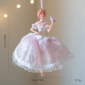 Decorative ballerina figurine with pink dress on a beige background, Obroi