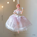 Decorative ballerina figurine with pink dress on a beige background, Obroi