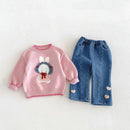 A toddler girl's two-piece knit outfit set featuring a pink long-sleeve sweater with a white bunny motif and blue denim pants with heart details, laid flat on a light textured background, Obroi