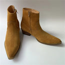 Pair of brown suede ankle boots on a white background, Obroi