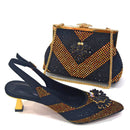 A women's slingback heeled shoe and a matching handbag, both embellished with gold rhinestones and floral embellishments, displayed on a white background, Obroi