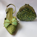 Green embellished shoe and matching handbag on a white background, Obroi