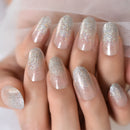Close-up of a hand with glittery silver and white nail polish on a neutral background, Obroi
