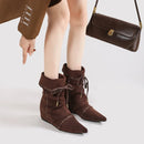 Brown suede ankle boots with matching handbag on a white background, Obroi