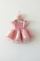 Pink children's dress with tulle and pearls on a white background, Obroi