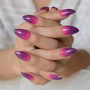 Close-up of hands with pink and purple gradient nail polish on a blurred background, Obroi