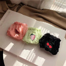 Three baby bloomers with fruit designs on a white surface, Obroi
