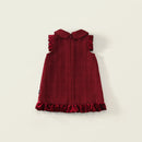 Red dress with ruffled collar and hem on a light beige background, Obroi