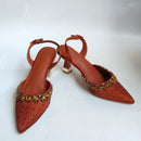 Brown pointed-toe shoes with embellishments on a white background, Obroi
