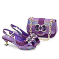 Purple high-heeled shoes and matching handbag with gemstone details on a white background, Obroi